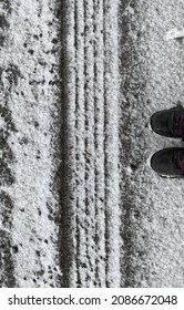 The shoes of the person showing the size of this trace are in plain view. Beautiful straight lines embedded in the snow. Ulverton, Quebec, Canada; March 17, 2020.