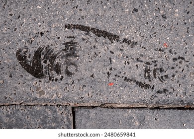 Shoes print on asphalt ground. Sneakers step black mark. Shoe prints on the wall. Human footprints. Footwear steps. Textured dirty wet sole. Minimalist concept. Top view. Close up. Copy space - Powered by Shutterstock