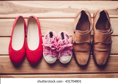 shoes, three pairs of dad, mom, daughter - the family concept 