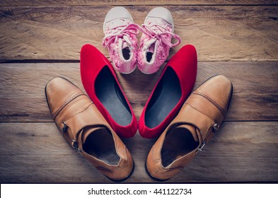 shoes, three pairs of dad, mom, daughter - the family concept