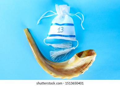 Shofar Horn And A Gift Bag For Bar Mitzvah. Greeting Card. Invitation A Party. Jewish Boy Automatically Becomes Bar Mitzvah When He Turns 13 Years Old. Top View.