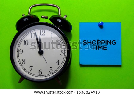 Shooping Time write on sticky notes. Isolated on green table background