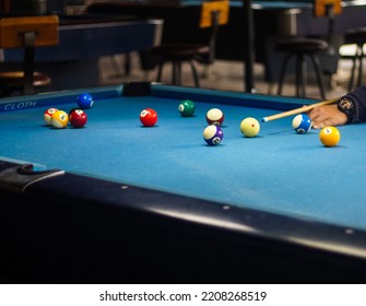 Shoot Balls Billiard With Cue Stick On Pool Table