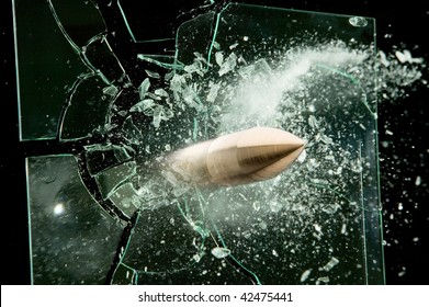 Shooting bullet breaks through the glass