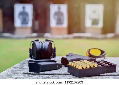 Shooting Range.
Shotguns, Ammunition, Ear Plugs, And Accessories For Taking Pictures On The Table During Shooting And Shooting Targets. 