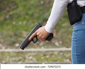 Shooting Range. Woman With Gun.