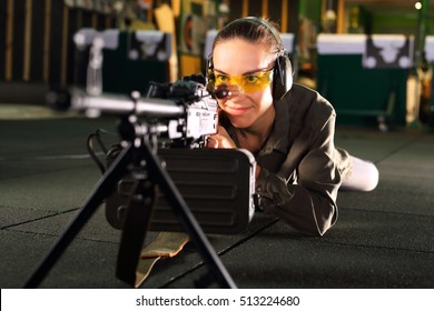 Shooting at the shooting range
The woman at the shooting range shot from a rifle.
