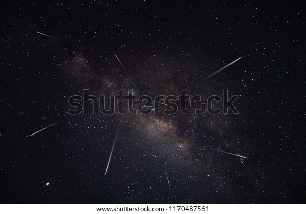 The shooting stars with milky way and stardust in\
the night sky.