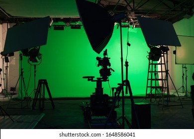 Shooting studio with professional equipment and green screen - Shutterstock ID 1648586041