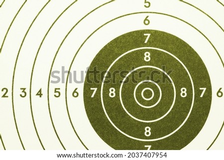 Shooting target. Green olive tinted background or wallpaper. Light backdrop about shooting training, military service and sniping