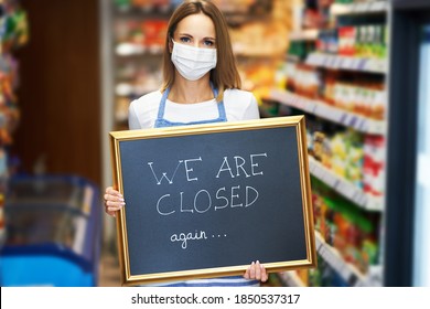 Shop Assistant Holding Announcement Board