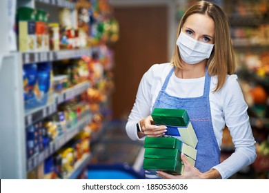 Shop Assistant Working In Medical Mask