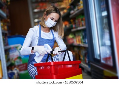 Shop Assistant Working In Medical Mask Disinfecting Carts