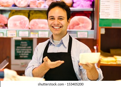 Shop Keeper Serving Cheese