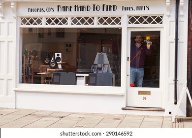 Shop Owner Opening Up Record, CD And Hi-fi Shop