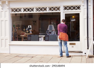 Shop Owner Opening Up Record, CD And Hi-fi Shop