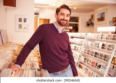 Shop Owner Posing In A Record Shop, Smiling