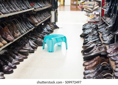 Shop Of Second Hand Shoes With Chair For Try To Wear.