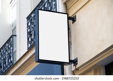 Shop Sign Mockup. Rectangular Vertical Storefront On A Wall In Street Template