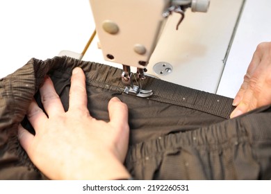 Shop For Tailoring. A Woman Creates Clothes On A Sewing Machine. Fashion Industry For People. Stylish Fashionista Woman Creating New Cloth Design Collection. Tailor And Sewing.