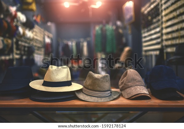 shop window\
with hats and caps in a clothing\
store