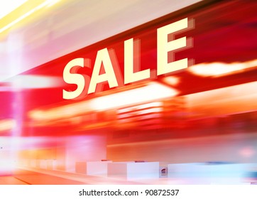 Shop Window With Sale Sign At Night