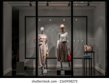 Shop Windows And Mannequins. Fashion Store Exterior. City Night Boutique. Front View From Street Outdoor. LED Light. City Facade Background. Budapest, Hungary, May 2022