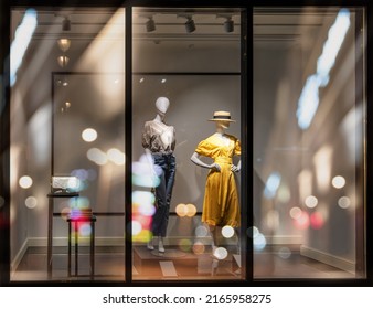 Shop Windows And Mannequins. Fashion Store Exterior. City Night Boutique. Front View From Street Outdoor. LED Light. Selective Focus. Budapest, Hungary, May 2022