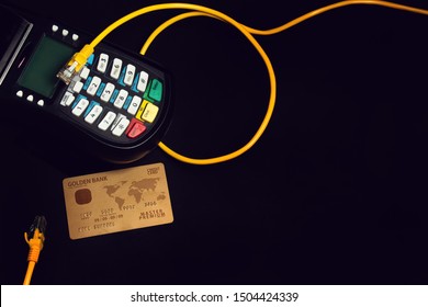 shoping electronic payment device reader machine with gold premium credit card of digital banking investment financial and money concept on black background