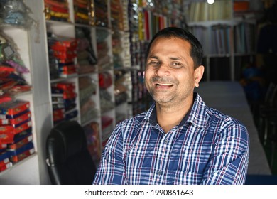 A shopkeeper is doing his small business with happiness