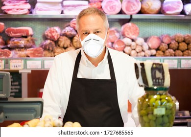 Shopkeeper Smiling In A Grocery Store