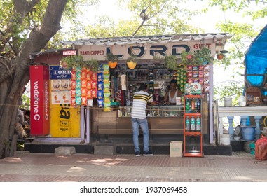 A Shopkeeper Talking With A Customer In His Fast Food Stall While Selling Hot Food, Packaged Foods And Cold Drinks During Summer In Street Of Kolkata West Bengal India South Asia Pacific 14 March 2021