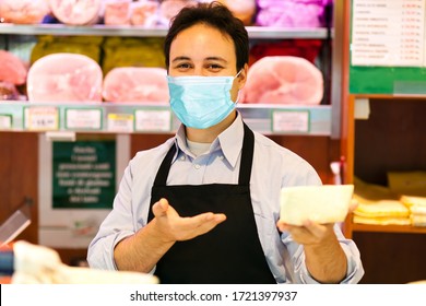 Shopkeeper Working In His Grocery Store Wearing A Mask, Coronavirus Concept