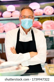 Shopkeeper Working In His Grocery Store