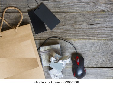 shopper with cyber monday (black Friday)  paperbag, PC mouse, laptop. ticket label Sale tag - online shopping concept