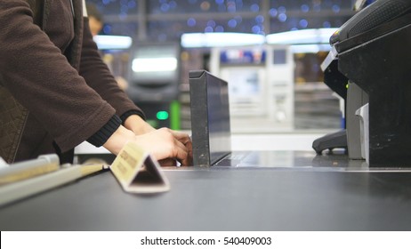 Shopper Paying For Products At Checkout. Foods On Conveyor Belt At The Supermarket. Cash Desk With Cashier And Terminal In Hypermarket. Working Of Cashier. Shopping At Store. Close Up