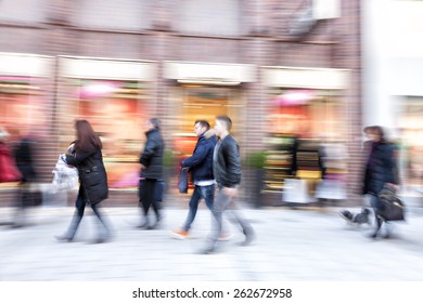 Shopper Walking Against Shop Window, Zoom Effect, Motion Blur