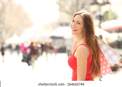 Shopper Woman Walking And Shopping In The Street In Summer Holding Bags