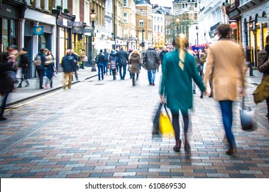 Shoppers Holding Hands In Busy London High Street