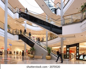 Shoppers at multilevel shopping center - Shutterstock ID 2070520
