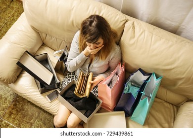 shopping addicted young woman spend too much money worried with empty wallet