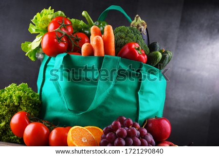 Shopping bag with fresh vegetables and fruits.