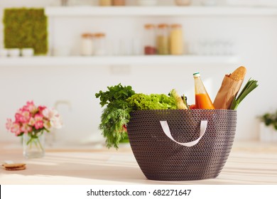 Shopping Bag Full Of Fresh Food On Kitchen Desk