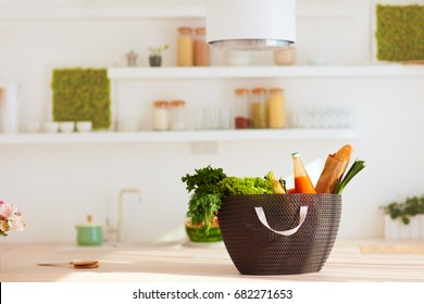 Shopping Bag Full Of Fresh Food On Kitchen Desk