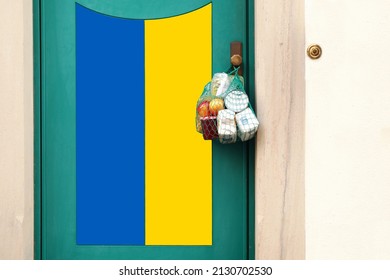 Shopping bag with Merchandise, goods and food is hanging at the front door, neighborhood Assistance. Ukrainian flag painted on the Door. concept of Victim, Freedom, Protest, peace demonstration  - Shutterstock ID 2130702530