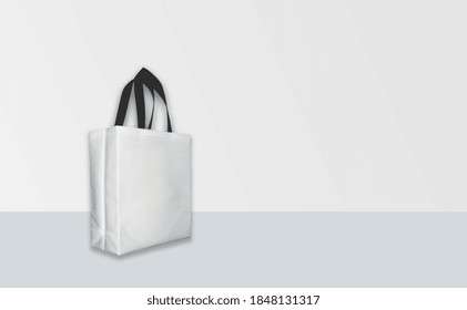 Shopping Bag For Mock-up. ECO White Bag On White Table With Background. Zero Waste Concept. Copy Space For Text And Logo