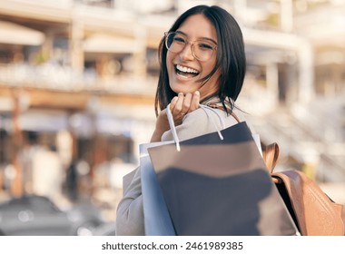 Shopping, bag and portrait of woman in city excited for discount sale, promotion or luxury boutique. Laughing, girl and customer with retail deal and purchase clothes or fashion at store in New York - Powered by Shutterstock