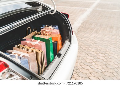 Shopping Bags In Car Trunk Or Hatchback, With Copy Space. Modern Shopping Lifestyle, Rich People Or Leisure Activity Concept
