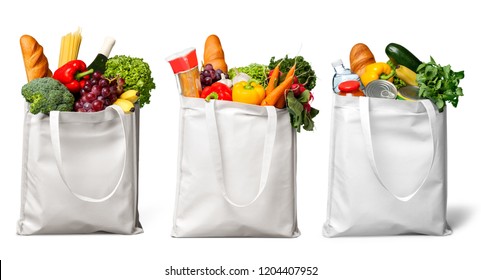 Shopping bags with groceries isolated on white - Shutterstock ID 1204407952