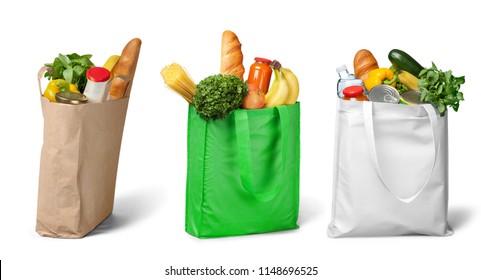 Shopping bags with groceries on white